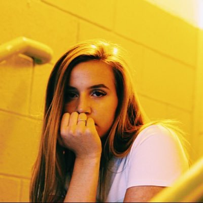 Posing in a illuminated stairwell, Appleton shows off her modeling smolder.