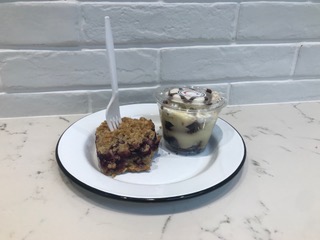 The blueberry crumble bar and tuxedo cake cup, made fresh from the bakers of Certified Kitchen and Bakery, now open near Hyde Park. (McKenna Johnson)