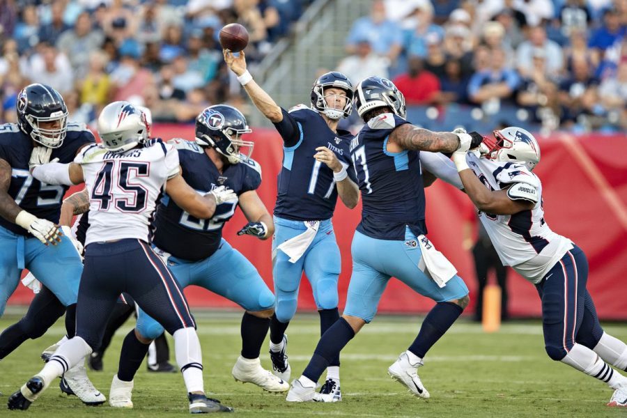Tennessee Titans quarterback, Ryan Tannehill, throwing a pass during the Patriots v. Titans week one playoff game (Wesley Hitt/Getty Images).