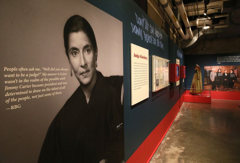 Large scale photos and quotes from RBG kept up in the "Notorious RBG" exhibit, now being used to honor her memory. (Stacey Wescott / Chicago Tribune)