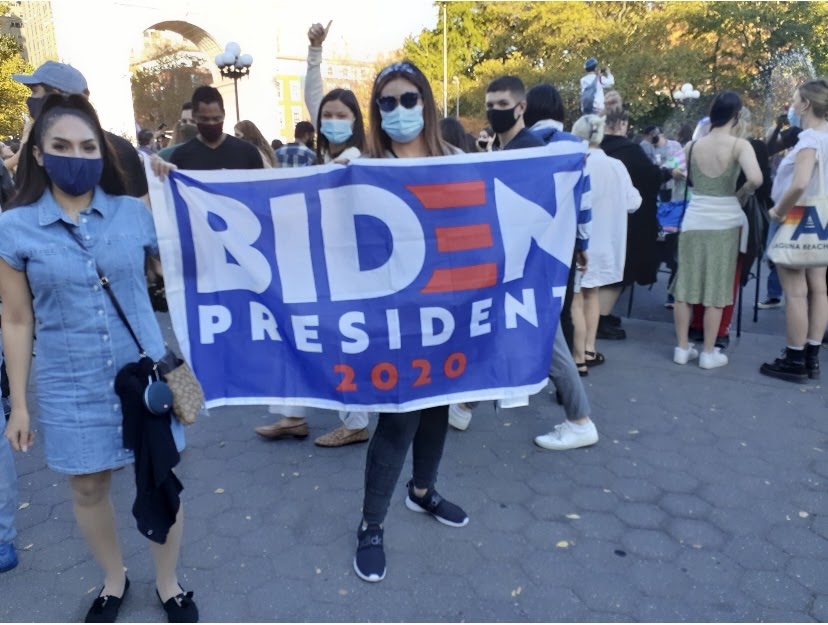 People celebrating the AP calling the election for Joe Biden at Washington Square Arch in New York City. (Leslie Bock)