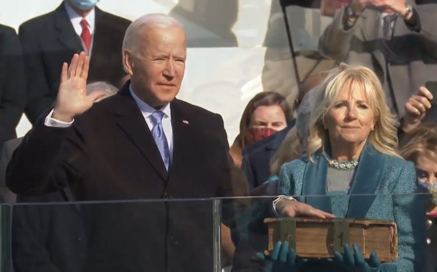 President Joe Biden takes the presidential oath beside his wife, Fist Lady Dr. Jill Biden. 