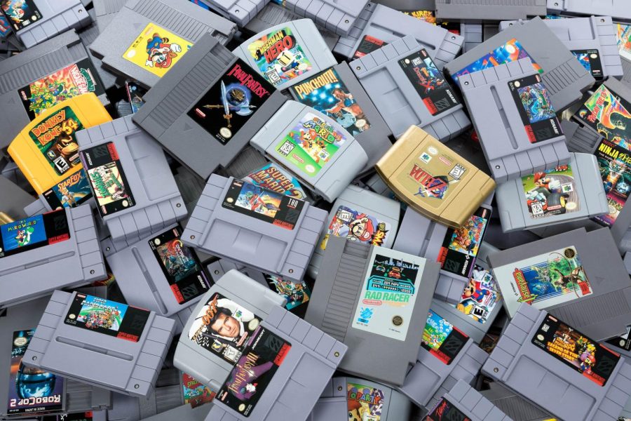 A pile of NES, SNES, and N64 games.