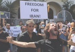 A man cuts his hair during a protest in memory of Mahsa Amini in Iran (Reuters.com)