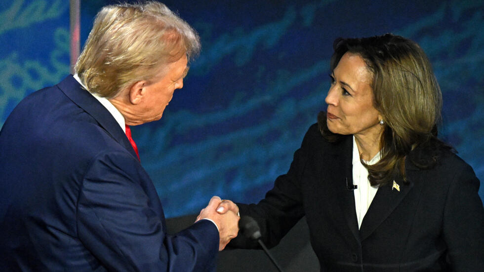 The two presidential candidates shaking hands at the beginning of the debate.